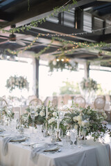 lovely Table setting for magnificent composition from flowers at a wedding