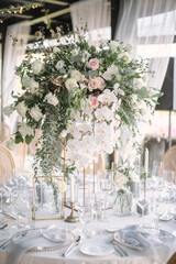 lovely Table setting for magnificent composition from flowers at a wedding