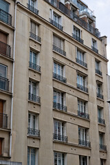 Obraz premium Apartment Building Exterior with Windows and Balconies