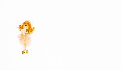 The angel is isolated on the white background with copy space. The atmosphere of Christmas and New...