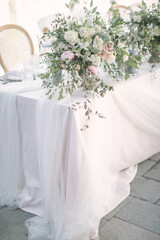 lovely Table setting for magnificent composition from flowers at a wedding , Centerpiece white and orange color palette flower bouquet arrangement