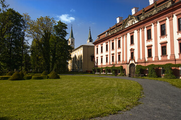 Castle building with castle park. Sunny day in beautiful castle park. Historical building, monuments of the Czech Republic.