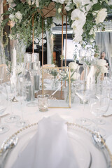 lovely Table setting for magnificent composition from flowers at a wedding , Centerpiece white and orange color palette flower bouquet arrangement