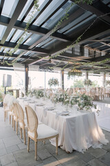 lovely Table setting for magnificent composition from flowers at a wedding , Centerpiece white and orange color palette flower bouquet arrangement