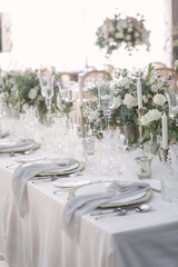 lovely Table setting for magnificent composition from flowers at a wedding , Centerpiece white and orange color palette flower bouquet arrangement