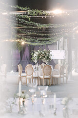 lovely Table setting for magnificent composition from flowers at a wedding , Centerpiece white and orange color palette flower bouquet arrangement