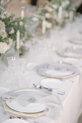 lovely Table setting for magnificent composition from flowers at a wedding , Centerpiece white and orange color palette flower bouquet arrangement