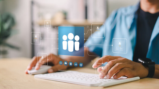 Digital HR system interface showing user profile, team icons, and data dashboard. Businessman managing personnel or customer information via online platform at workspace.