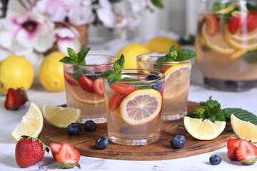 Lemonade with strawberries, blueberries and mint. Perfect for a hot summer day