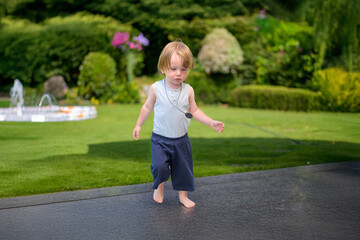Fototapeta premium Barefoot Toddler Walking Outdoors