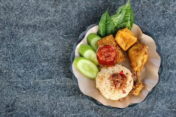 Nasi tutug oncom is a typical Indonesian Sundanese food. Rice mixed with oncom and spicy.
