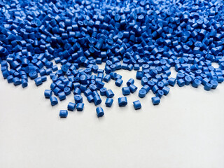 Blue polymer granules, blue masterbatch granules, cold cutting material type, isolated on white background for product catalog design of plastic manufacturing industry company profile