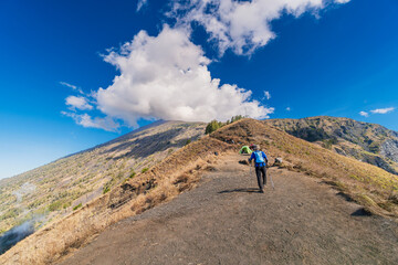 Hiker and traveller hiking at Mount Rinjani, Lombok, the second highest volcano in Indonesia.