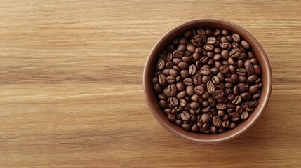 An atmospheric photograph of a small, minimalist ceramic bowl filled with chocolate covered coffee beans, placed off-center on a smooth, light wooden table, with natural light creating soft shadows