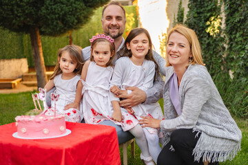 Joyful family celebration in a sunny garden setting