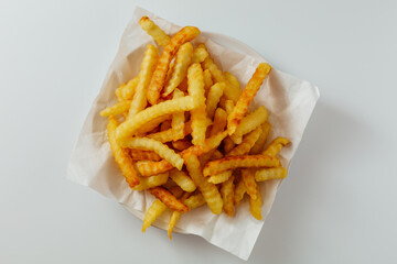 Crispy Golden French Fries Served in a White Paper Container