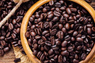 Freshly Roasted Coffee Beans in Wooden Bowl on Rustic Background