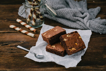 Delicious Chocolate Brownies with Nuts on Rustic Wooden Table