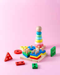 Colorful Wooden Stacking Toys on Pink Background for Children Play