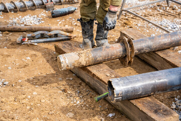 Opening of container with soil sample extracted from borehole. Preparation of core material for...