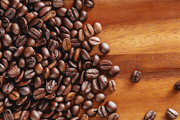 Freshly Roasted Coffee Beans Spread on Wooden Surface