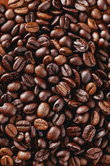 Dark Roasted Coffee Beans Spread Evenly on a Wooden Table Surface