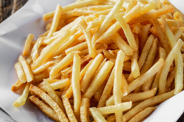 Crispy Golden French Fries Served on a White Plate for Snack Time