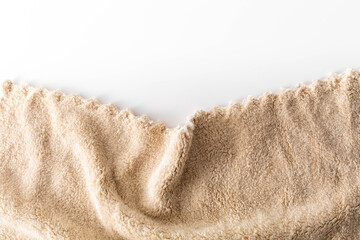 Soft Beige Fleece Fabric with Wavy Edges on White Background