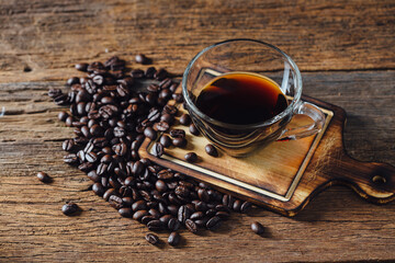 Fresh Brewed Coffee with Coffee Beans on Wooden Surface Background