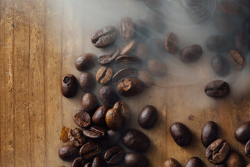 Fresh Coffee Beans on Wooden Surface with Smoke and Natural Light