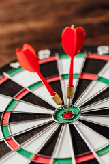 Precision Darts Striking the Bullseye on a Classic Dartboard