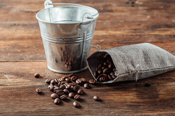 Rustic Coffee Scene with Metal Bucket and Burlap Coffee Bag