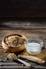 Fresh Soybeans with Glass of Soy Milk on Rustic Wooden Table