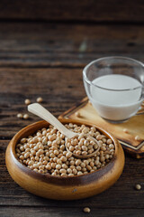 Fresh Soybeans in Wooden Bowl with Spoon and Soy Milk in Glass
