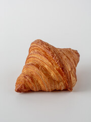 Golden Croissant on White Background Perfect for Breakfast and Snacks
