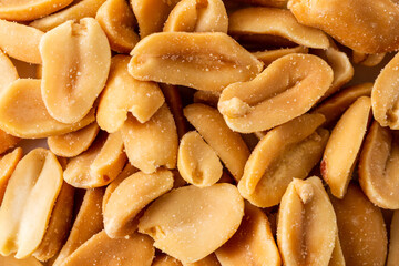 Close-Up of Roasted Salted Peanuts on a White Background