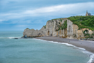 Landscape with spectacular beaches and high cliffs at Etretat, Normandy, France.