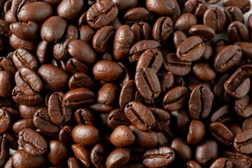 Close-Up View of Freshly Roasted Coffee Beans on White Background