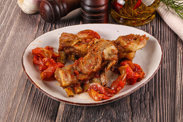 Baked lamb ribs with vegetables