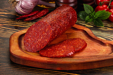 Spicy pepperoni sausages with sliced piece