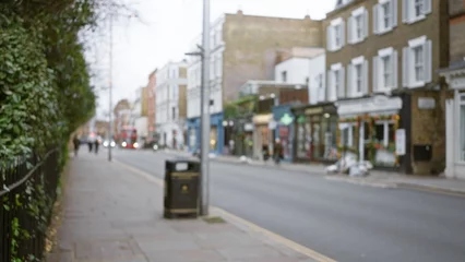 Fotobehang Herfst Blurred street scene in london with defocused buildings and people during winter creating a bokeh effect in an outdoor cityscape of the united kingdom.  © Krakenimages.com