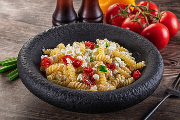 Italian pasta fusili with curd