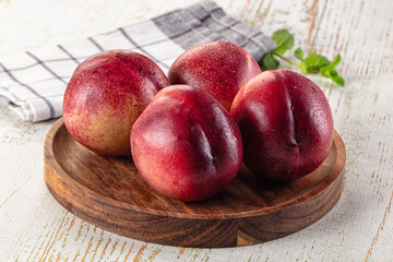 Ripe sweet juicy nectarines heap