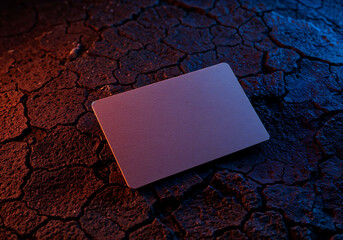 Gradient business card on cracked surface with neon lighting