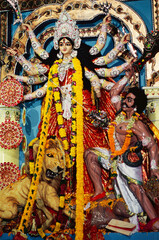 indian Durga Puja festival goddess idol mounted on lion killing demon India