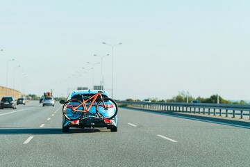SUV ride with cycling equipment mounted behind