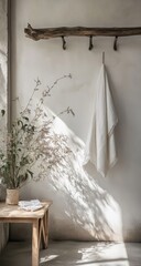Sunlight streams into a minimalist room, highlighting a draped white cloth