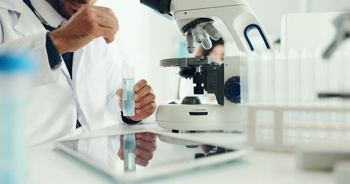 Hands, laboratory and man with dropper on microscope for analysis, medical research and study. Healthcare, pharmaceutical and scientist with liquid in test tube for medicine, experiment and vaccine