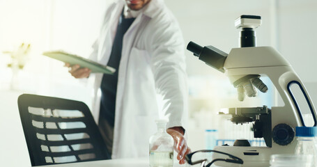 Man, scientist and hand with beaker, tablet and chemical solution for research study in lab....
