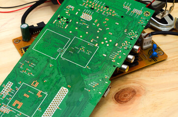 Printed circuit boards with electronic components close-up, photo for a project about the...